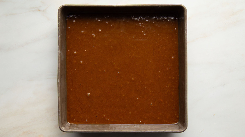 gingerbread cake batter in square pan