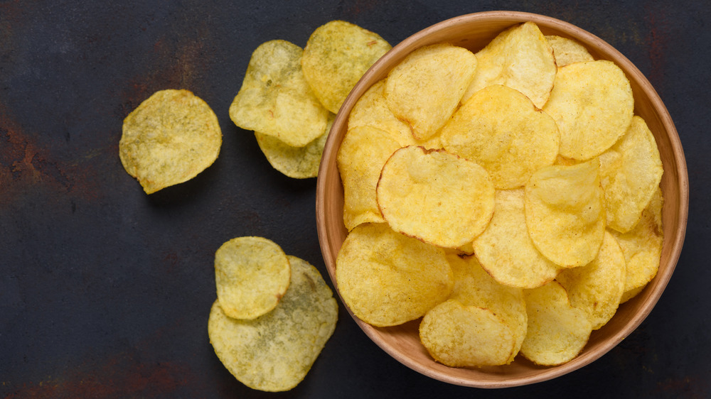 Potato chips on dark background