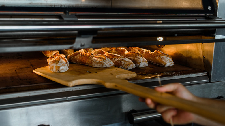 Loaves of French bread in oven