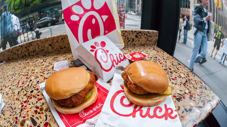 Chick-Fil-A sandwiches sitting on top of bags