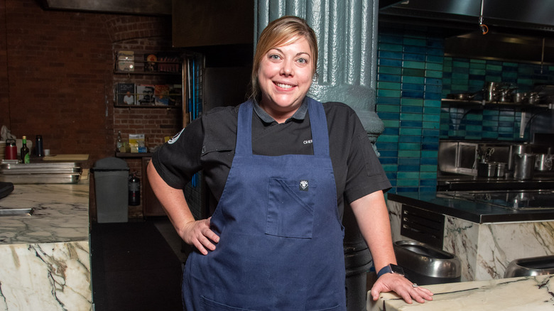 Chef Sarah Grueneberg serving smiling 