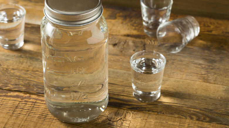 Jar of schnapps, shot glasses