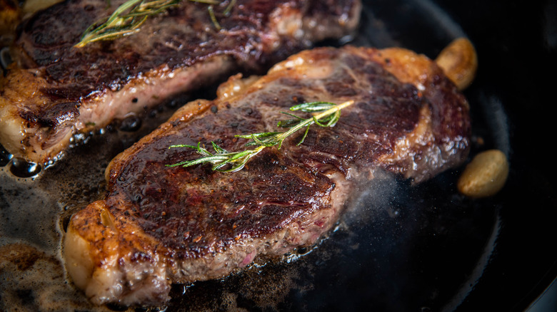 Steak with perfect crust in a skillet