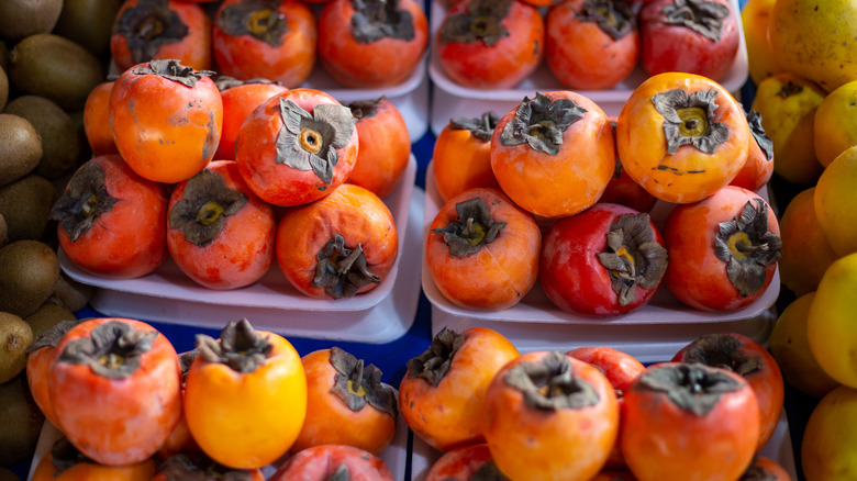 persimmons ready for sale at a farmer's market