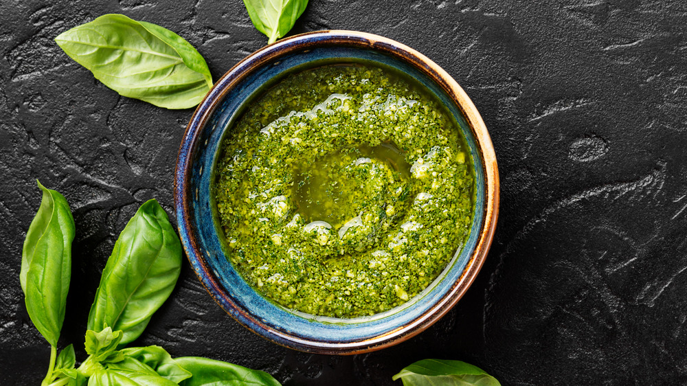 Pesto in a jar with basil