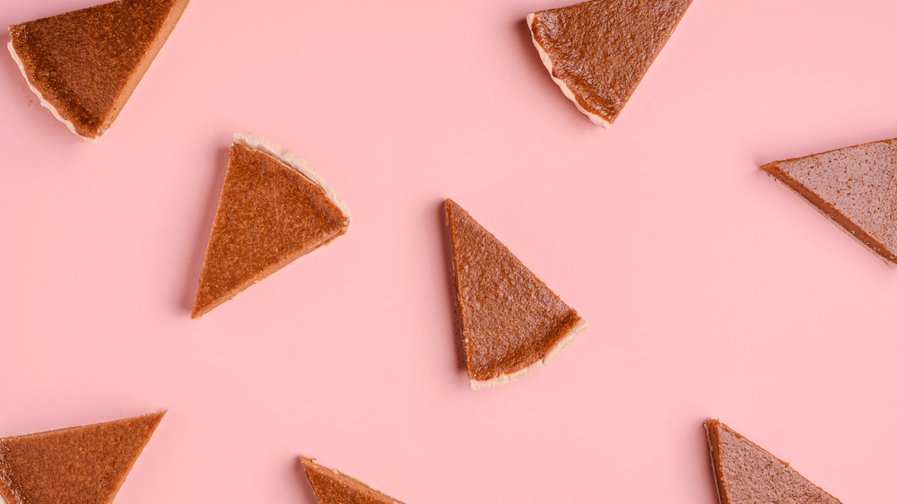 slices of pie on pink background