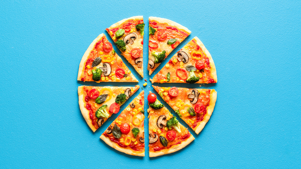 sliced pizza on blue background