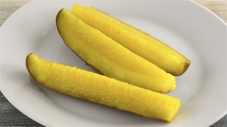 Dill pickle spears on a plate