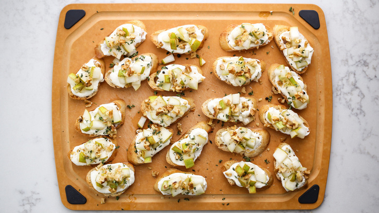 pear crostini on cutting board