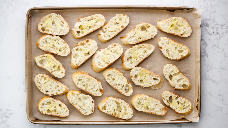 baguette slices on baking sheet