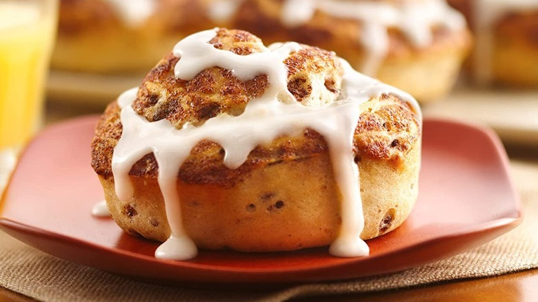 frosted cinnamon roll on a plate