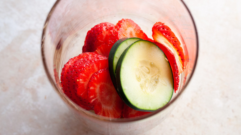 cucumber and strawberries in glass 