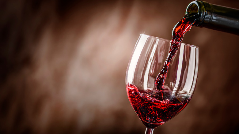 Pinot Noir being poured in a glass. 