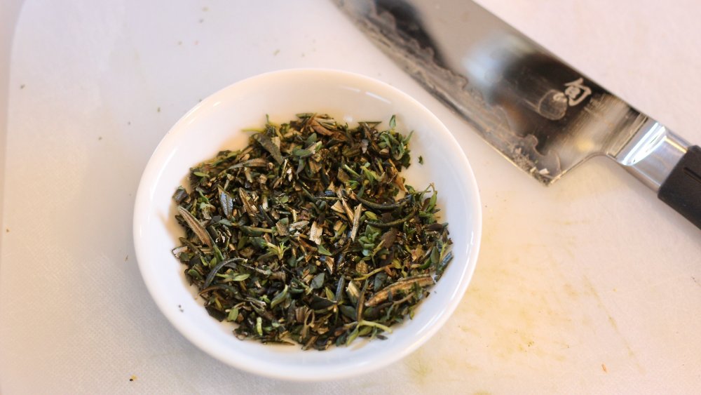 chopped rosemary and thyme for pistachio-crusted salmon