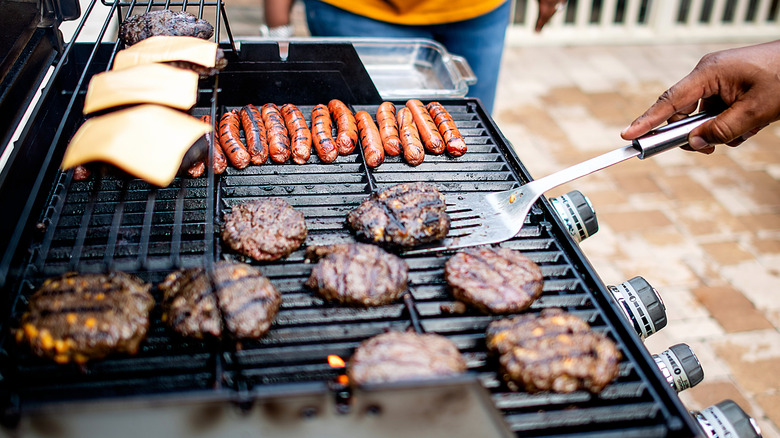 hamburgers and hot dogs grilling