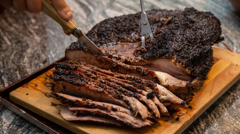 Slicing into fresh brisket