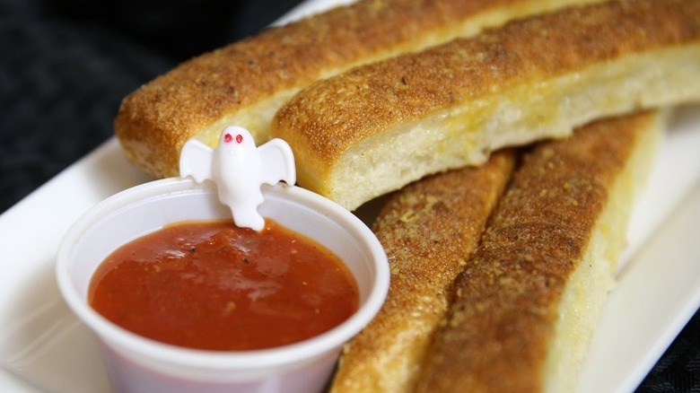 Breadsticks with marinara sauce and ghost