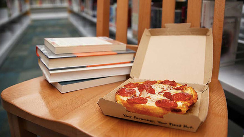 Pizza Hut pizza and books