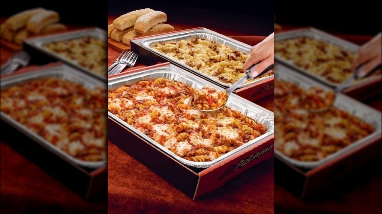 Trays of Pizza Hut's Meaty Marinara and Creamy Alfredo Pastas.