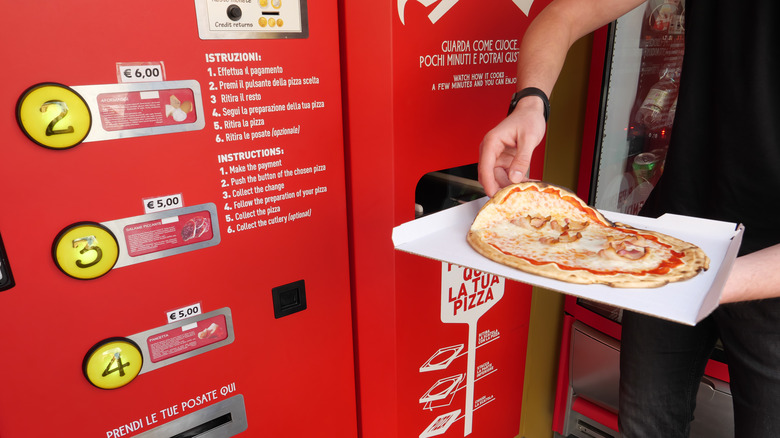 Pizza ATM displaying pizza