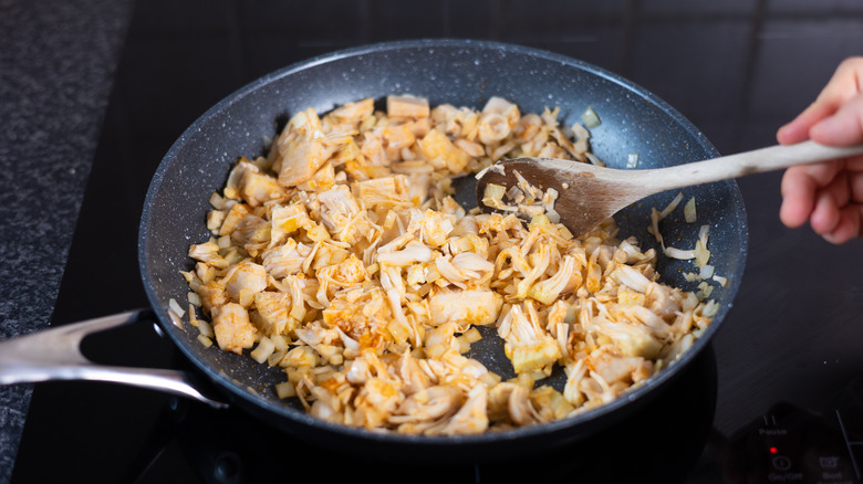 jackfruit and onion satueeing in pan 