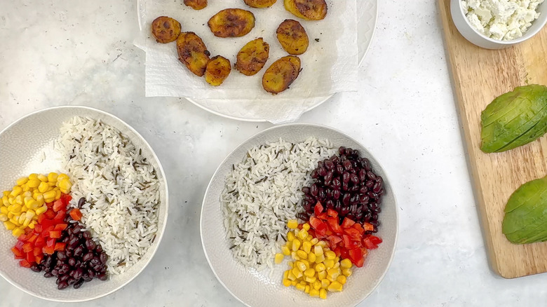 building bowls of plantain and wild rice salad