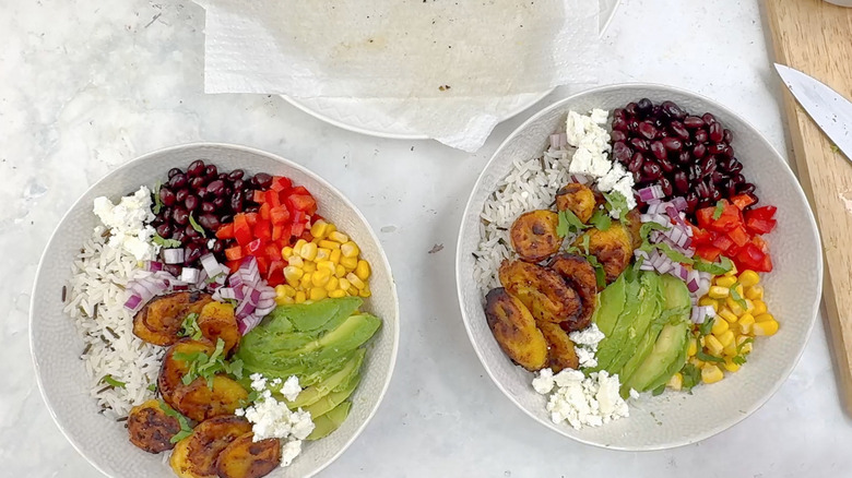 two bowls of plantain and wild rice salad