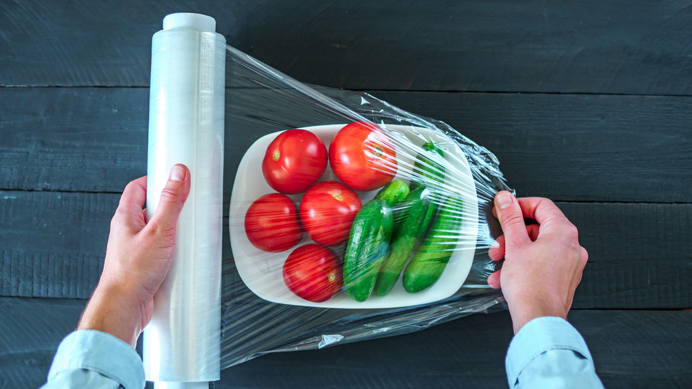 covering vegetables with plastic wrap