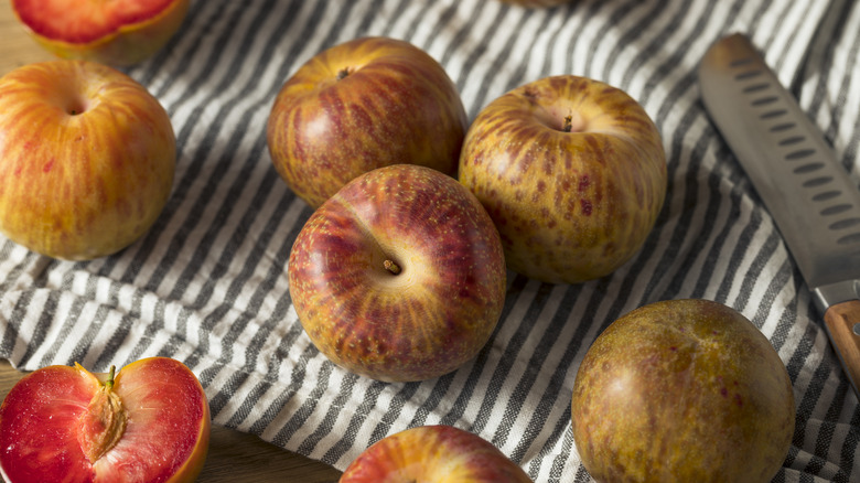 Pluots on striped cloth