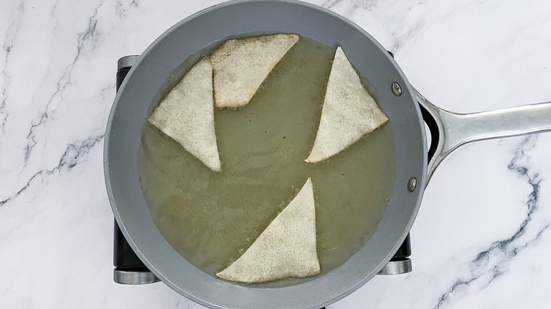 wontons wrappers frying in pan