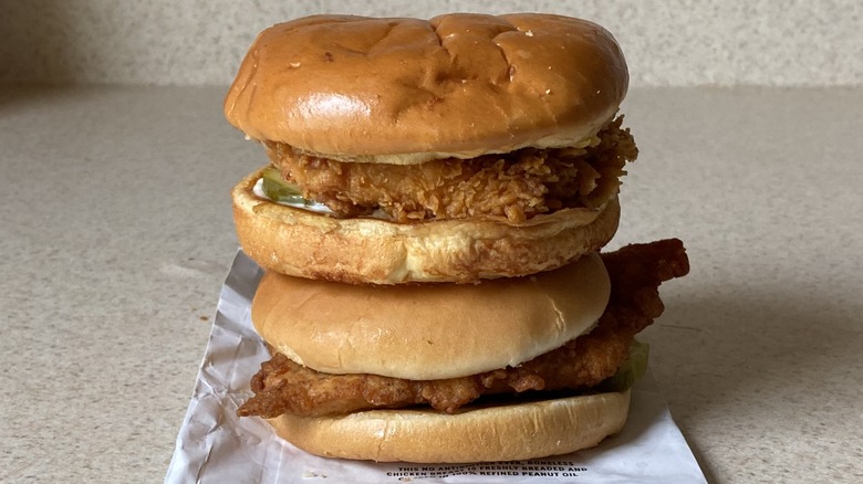 Popeyes and Chick-fil-A sandwiches stacked