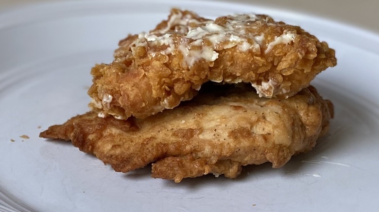 Popeyes filet stacked atop Chick-fil-A
