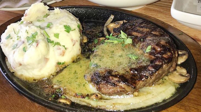 Bourbon street steak smothered with butter sauce