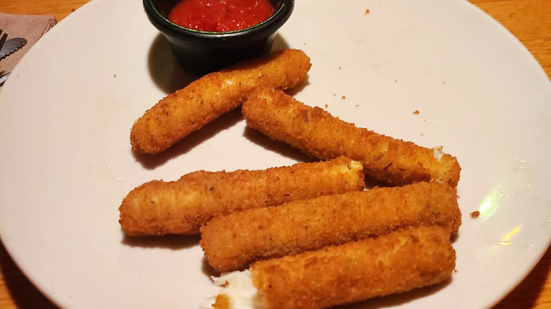 crispy mozzarella sticks on plate