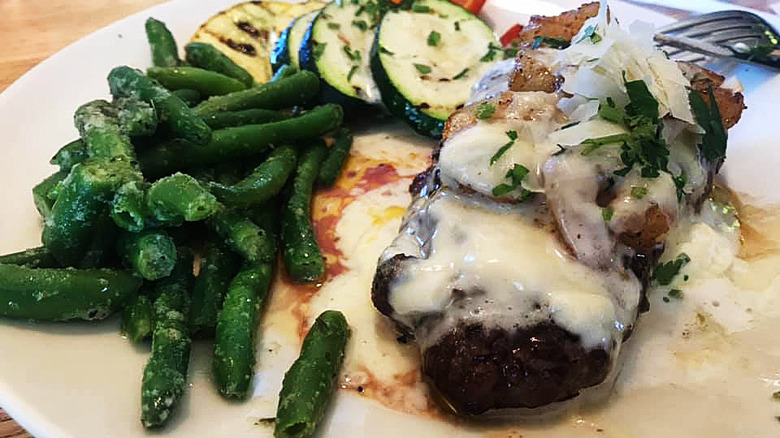 sirloin smothered with cheese, shrimp, and onions