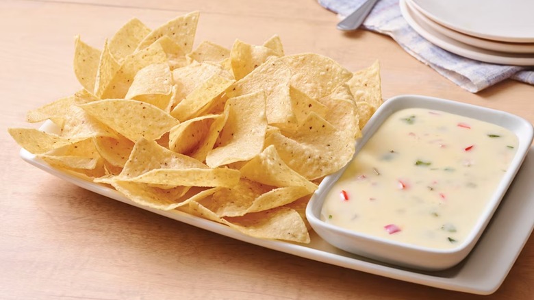 chips beside bowl of queso