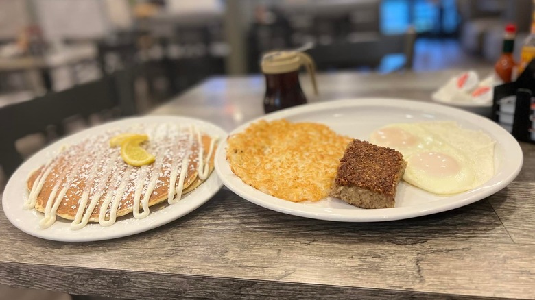 eggs hashbrowns meat and pancakes