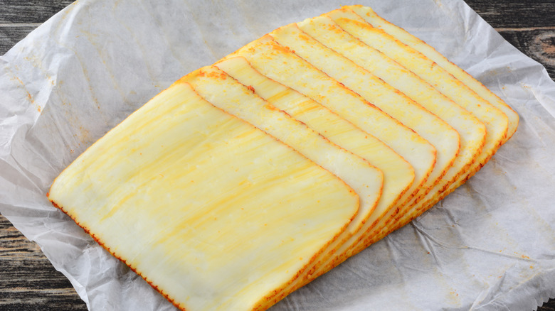 slices of cheese on a piece of deli paper