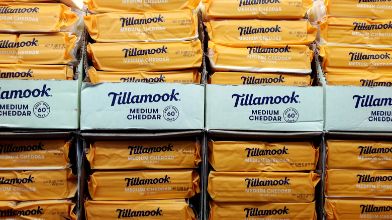 a stack of tillamook medium cheddar blocks