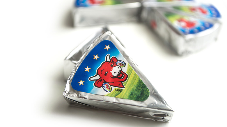 A foil-wrapped wedge of Laughing cow cheese