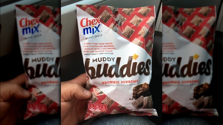 Someone Holding Bag of Chex Mix Brownie Supreme Muddy Buddies