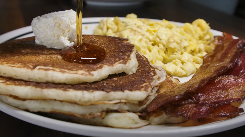 Pancakes with bacon and scrambled eggs