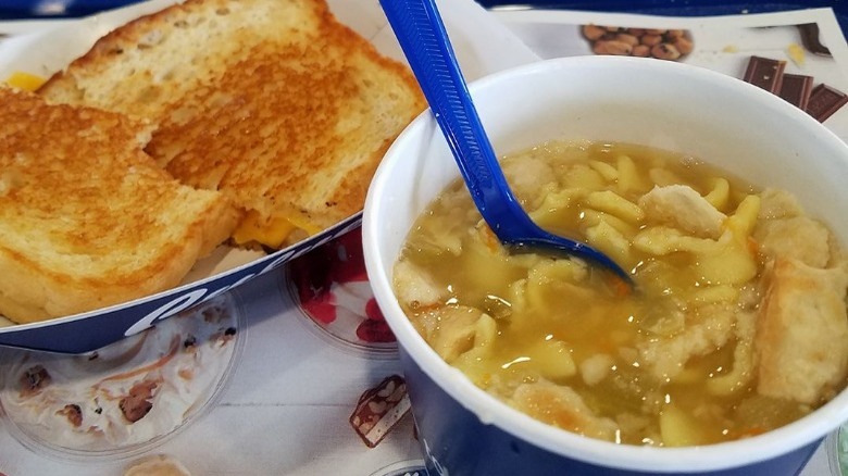 Bowl of Culver's Chicken Noodle Soup with a grilled cheese sandwich