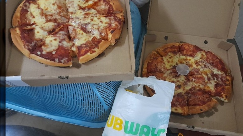 subway pizza in two boxes