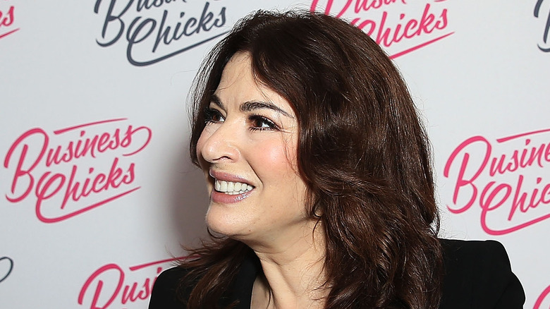 Nigella Lawson signing a book at an event 