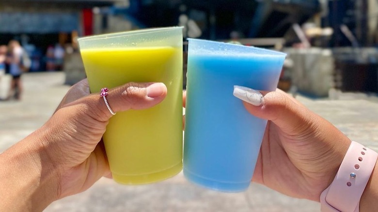 Cups of green and blue milk at Galaxy's Edge