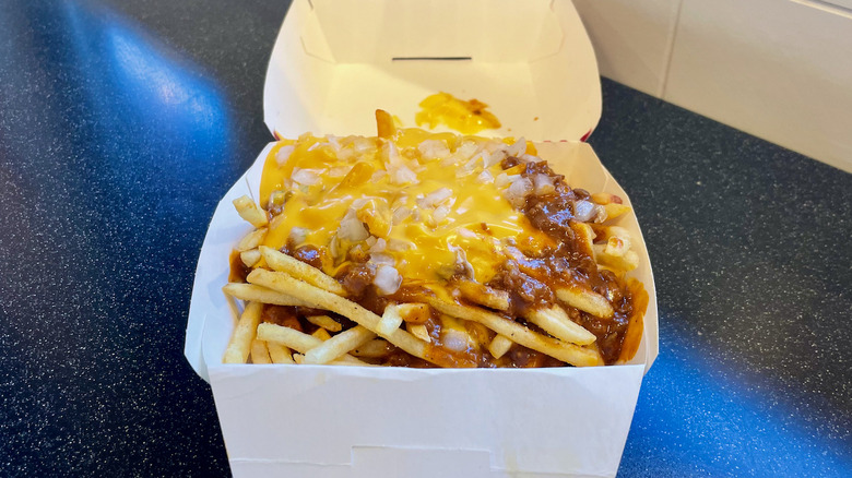 Freddy's chili cheese fries on table