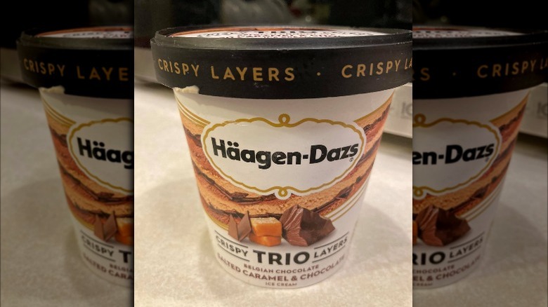 Container of Haagen-Dazs Salted Caramel Chocolate Trio Crispy Layers Ice Cream