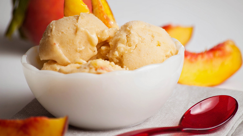 peach ice cream in bowl