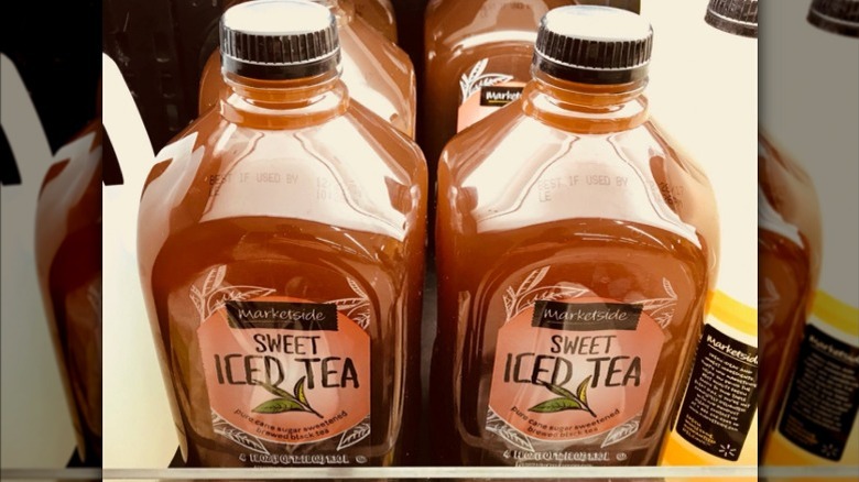 Bottles of Marketside sweet iced tea on a shelf